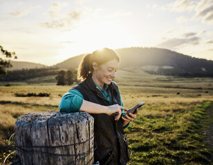 Farmer using a mobile phone in a field
