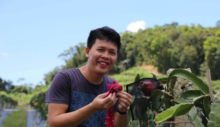 Ross eating Dragon Fruit crop