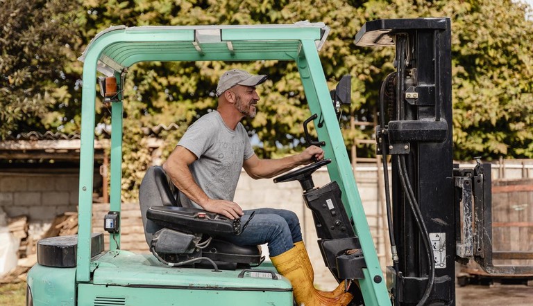 Farmer on Forklift.