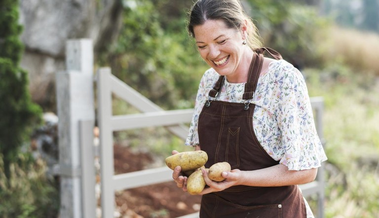 Woman Holding Potatoes
