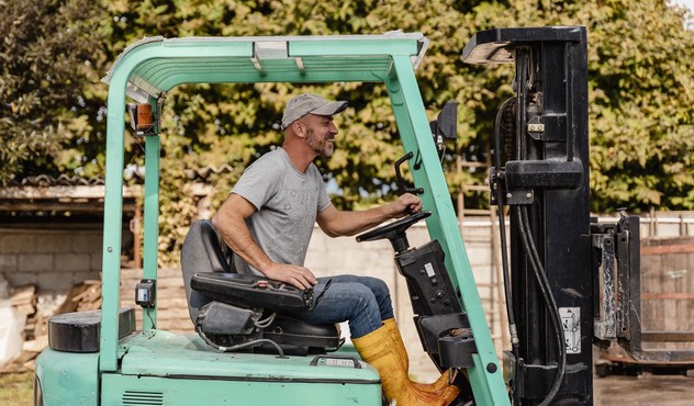 Farmer on Forklift.