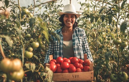 Woman holding tomatoes