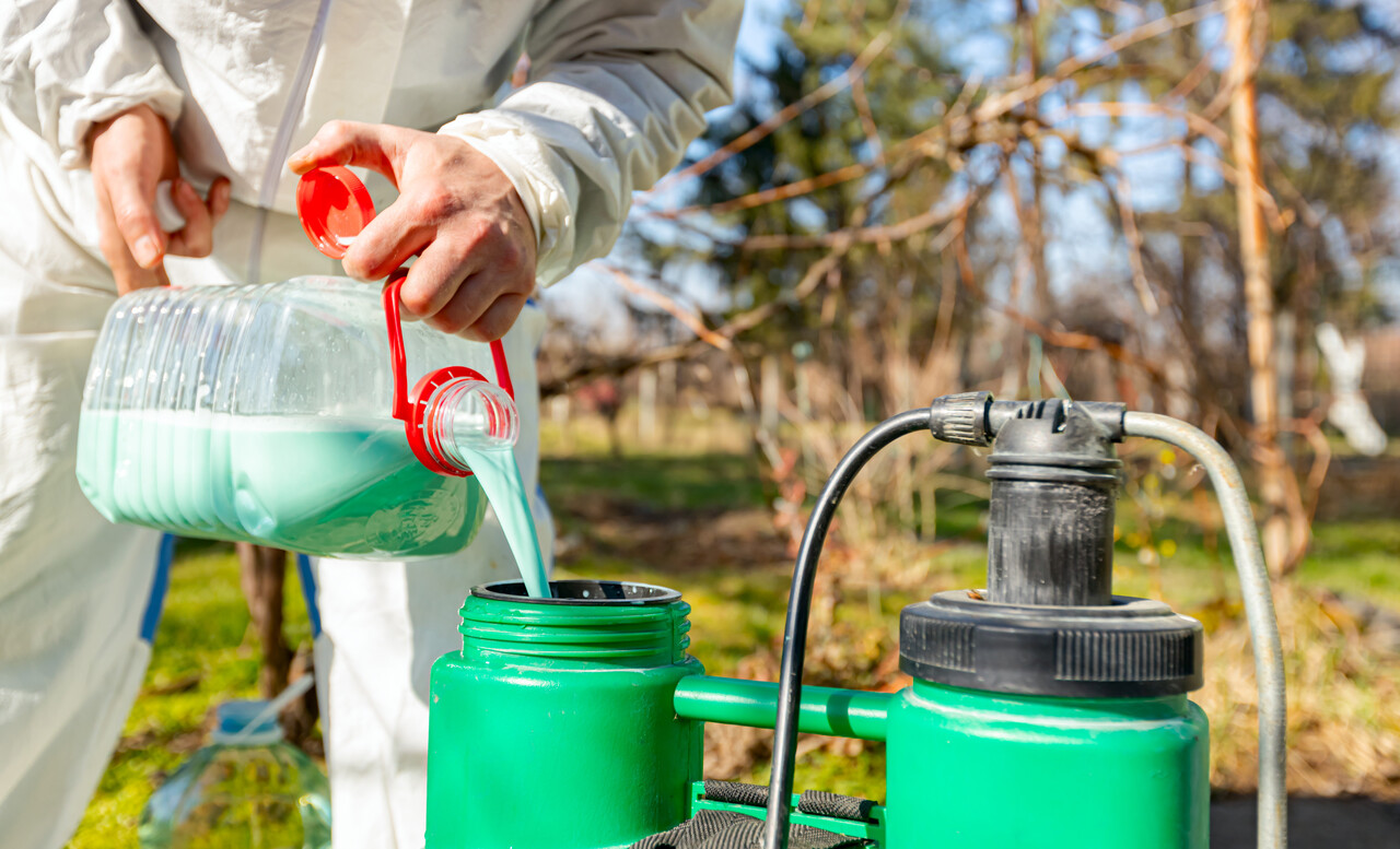 pouring-chemical-solution-into-sprayer
