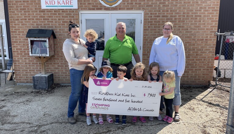 Stomping Grounds Initiative presenting cheque to Rosetown Kid Kare