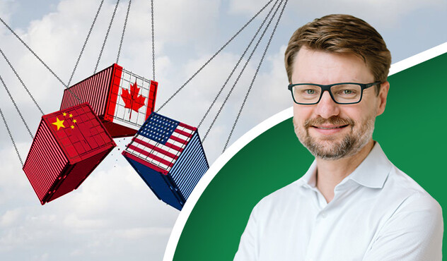 Shipping containers decorated in the USA, Canada, and China flag.