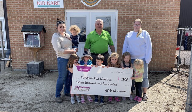 Stomping Grounds Initiative presenting cheque to Rosetown Kid Kare
